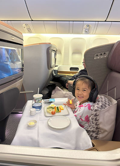 Whitney living her best life on Singapore Airlines business class flight from LAX to Tokyo layover