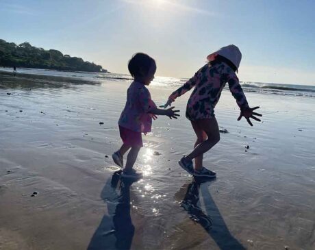 The kids running around the beach by Jimbaran Bay, searching for baby crabs, another kids club activity