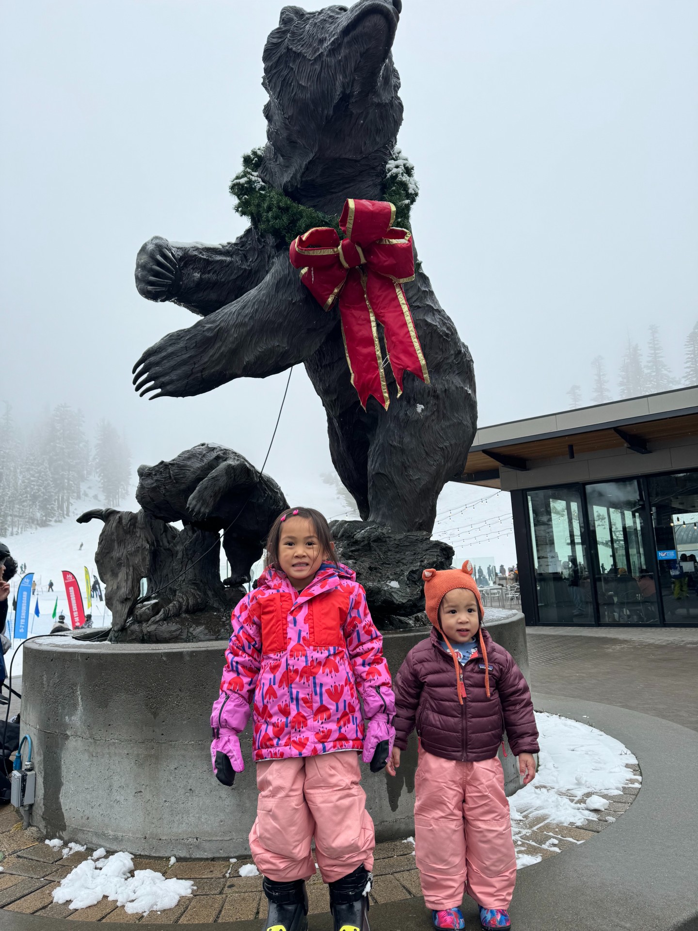 The kids dressed warmly ready to play in the snow. Find the Mammoth bear statue right when you get off the Village gondola at Canyon Lodge.