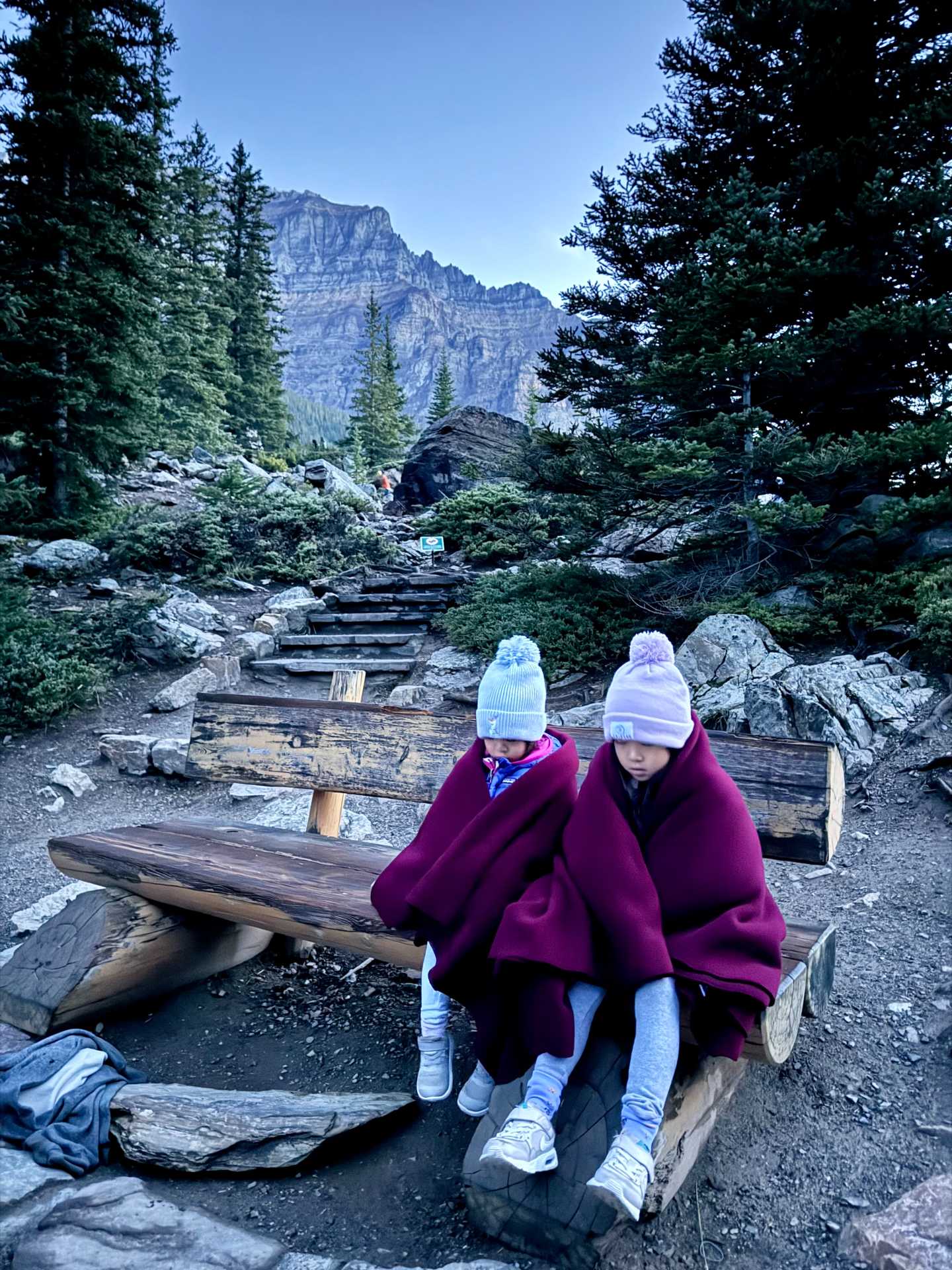 Finding the perfect spot early to capture Moraine Lake’s famous sunrise – definitely worth the wait! Tip: Head to the Rockpile Trail for the best panoramic views, and set up your camera on a tripod for those picture-perfect moments-1