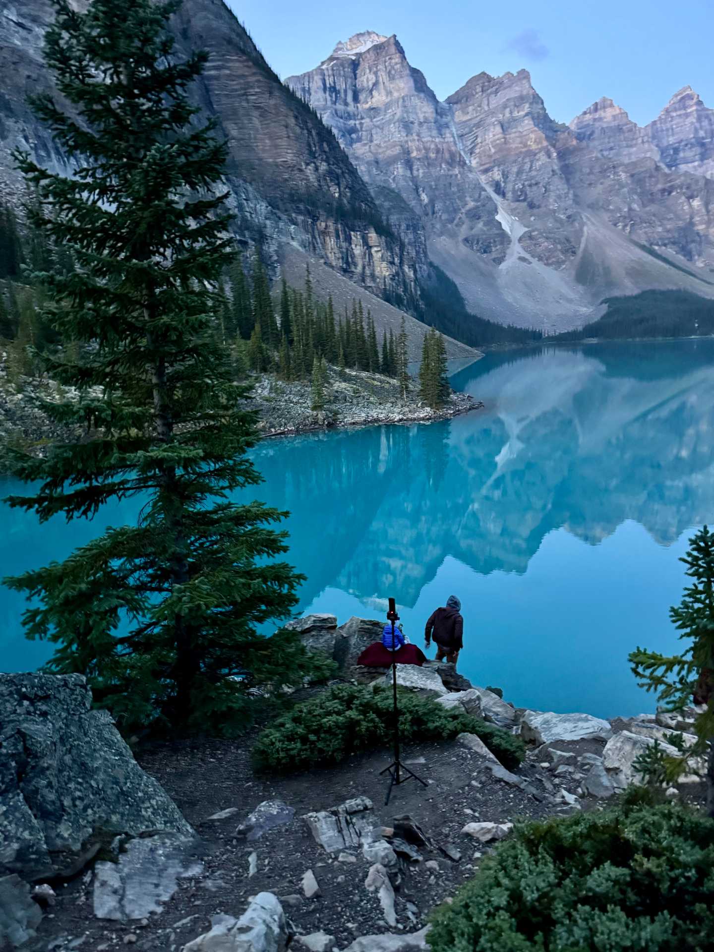 Finding the perfect spot early to capture Moraine Lake’s famous sunrise – definitely worth the wait! Tip: Head to the Rockpile Trail for the best panoramic views, and set up your camera on a tripod for those picture-perfect moments-2