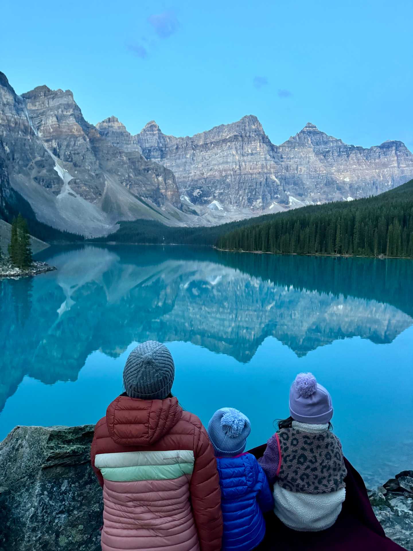 Finding the perfect spot early to capture Moraine Lake’s famous sunrise – definitely worth the wait! Tip: Head to the Rockpile Trail for the best panoramic views, and set up your camera on a tripod for those picture-perfect moments-3