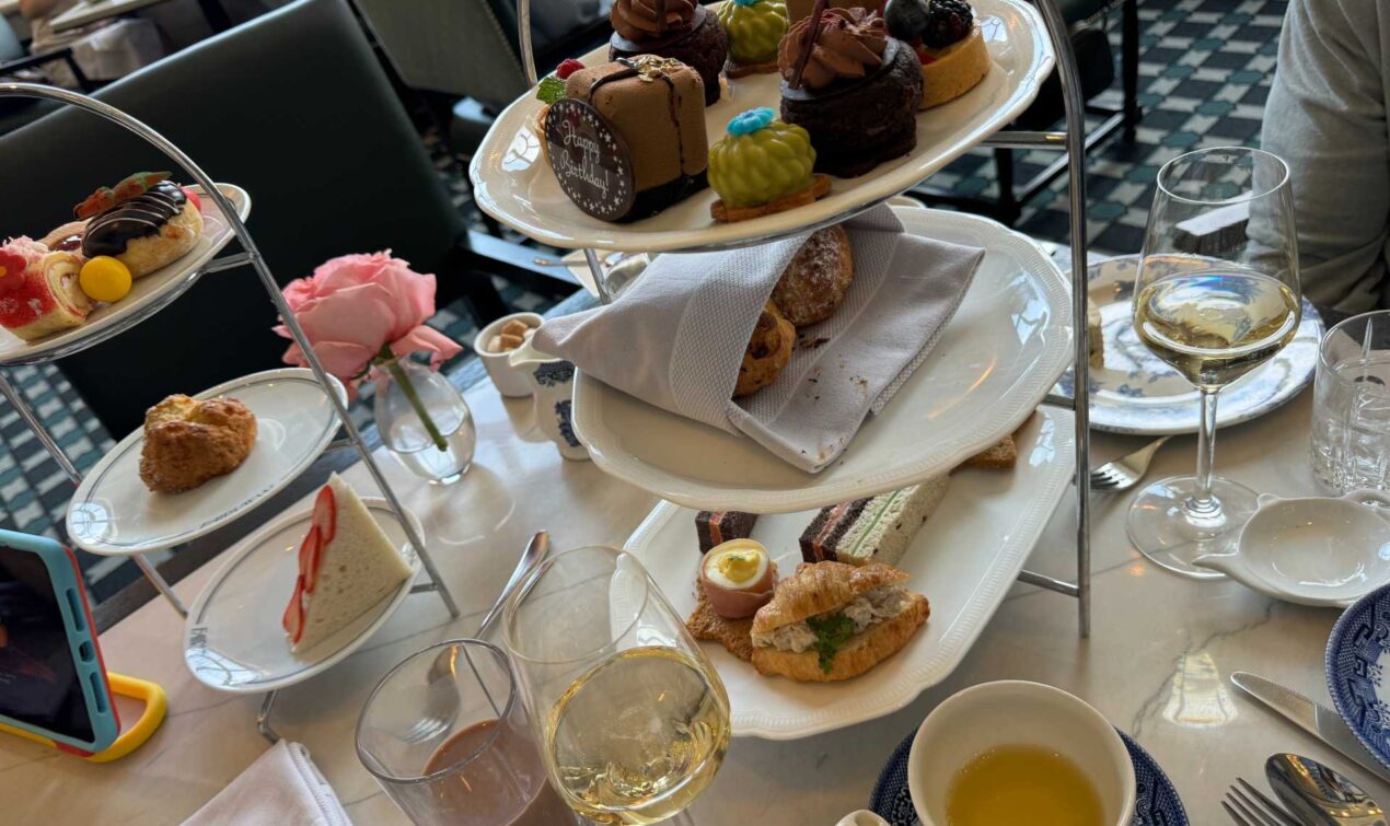 The stunning presentation of our afternoon tea spread, complete with delicate sandwiches, fresh scones, and mouth-watering desserts.
