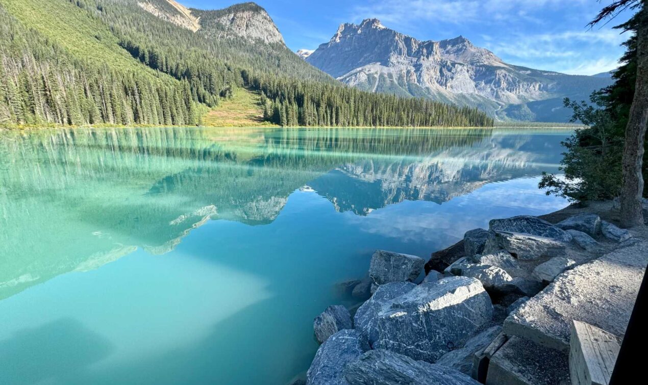 Emerald Lake's stunning green waters in the morning light. Tip: Arrive before 9 a.m. to secure a parking spot and enjoy the tranquil beauty of the lake before the crowds arrive.