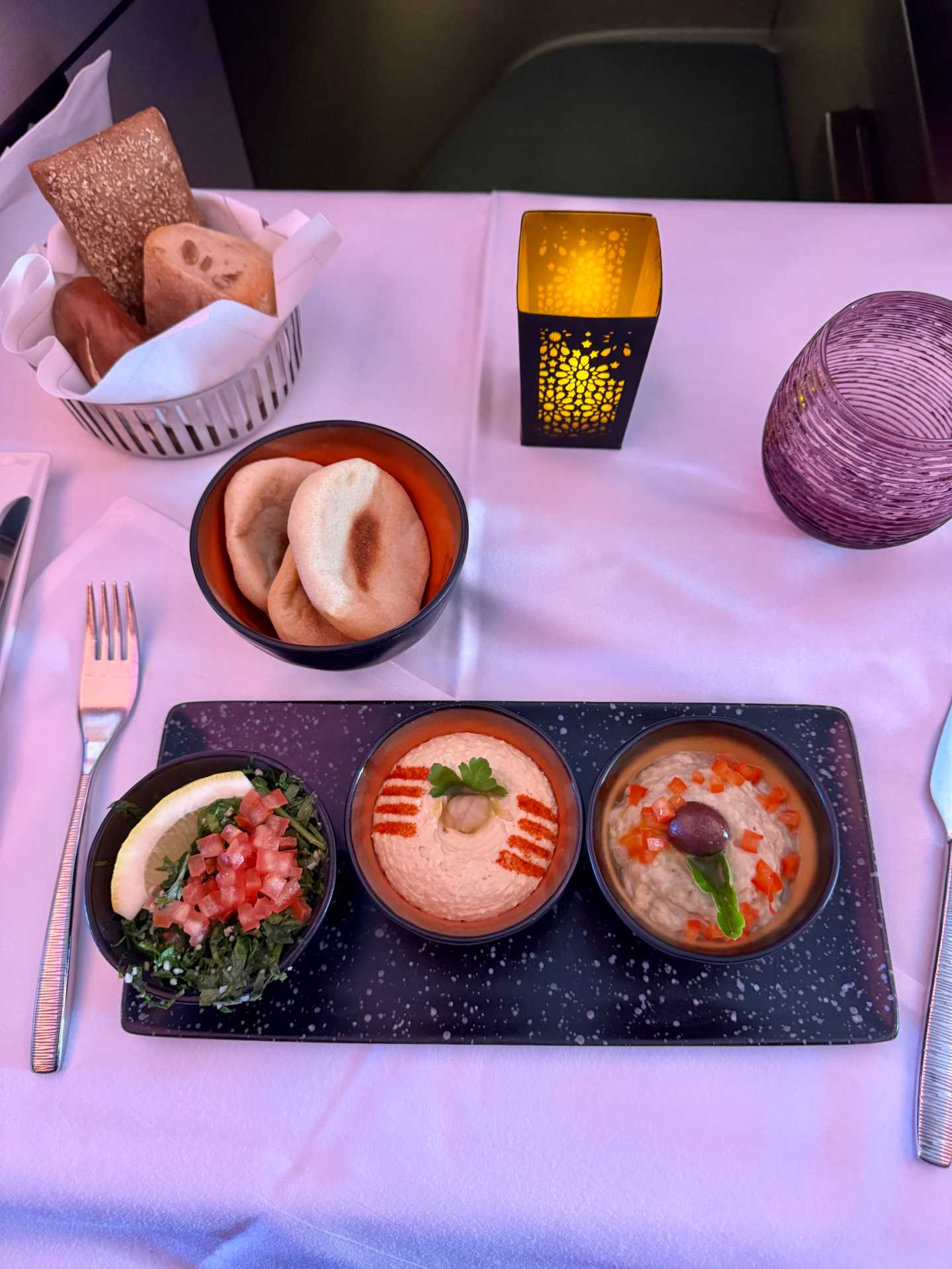 The in-flight dining on Qatar Airways Business Class was just okay. While the presentation was beautiful and the service attentive, some of the dishes were a bit heavy or dry, and there weren’t any dedicated kid-friendly options. A few items we were looking forward to had already run out, but overall, the meals got the job done during a long-haul flight-2