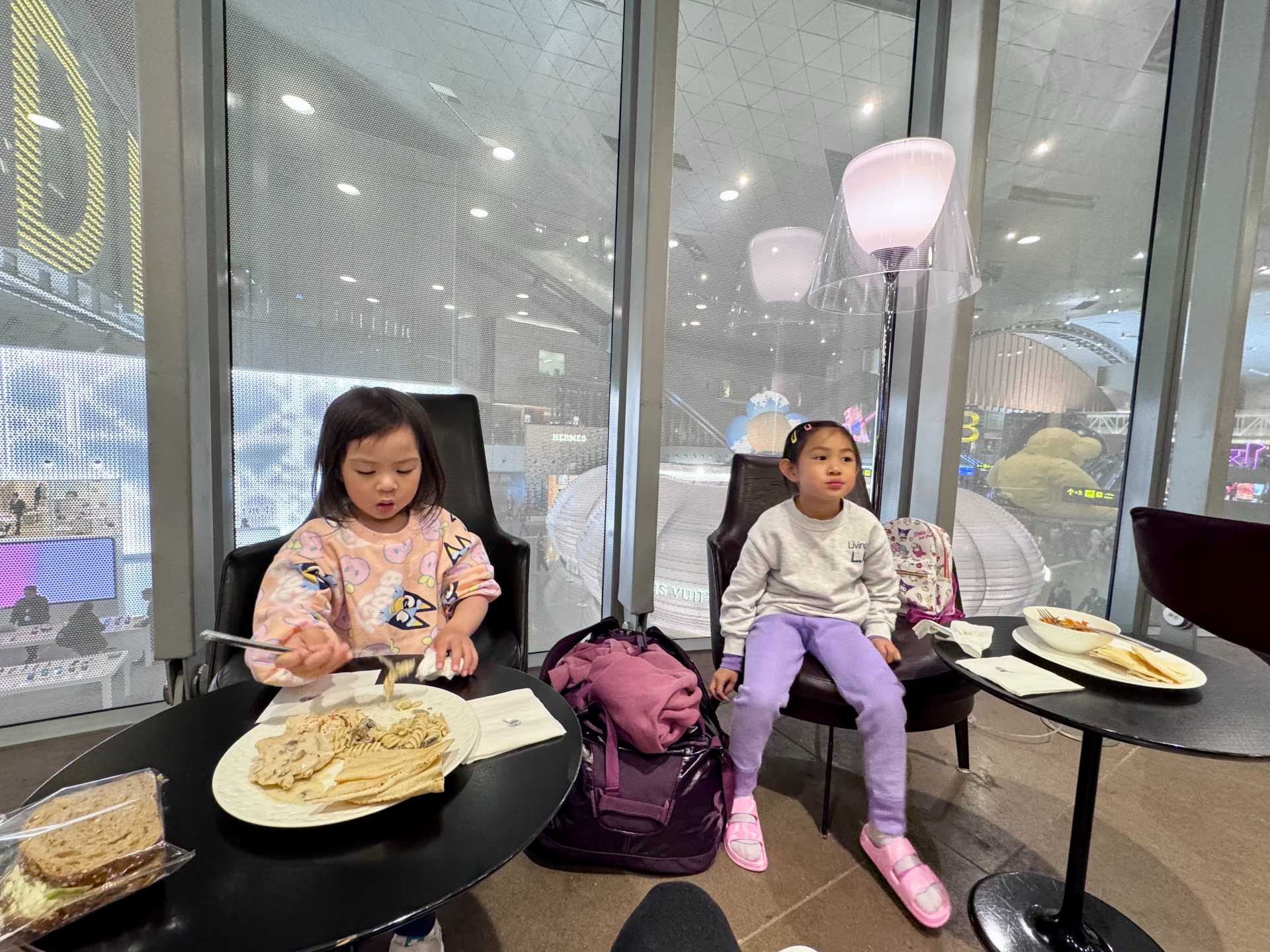 The Al Maha Lounge at Hamad International Airport's main terminal can be easily found by looking for this escalator. The kids were happy with its’ simple food options like pasta and chicken. The Al Maha Lounge serving Gates D and E offered a quieter space with plenty of seating. If you’re traveling with kids and looking for a low-key, family-friendly lounge, Al Maha is a solid option-2