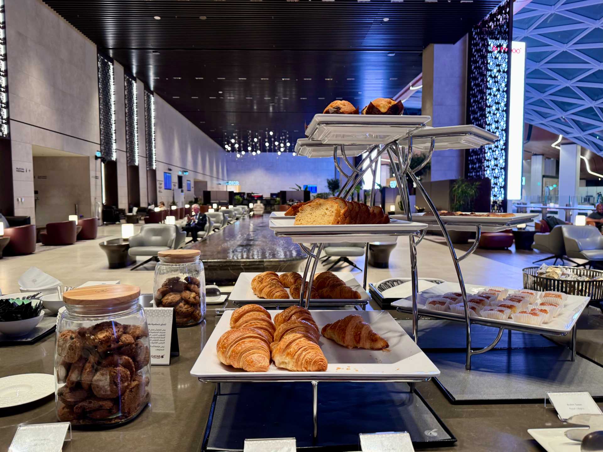 The Al Mourjan Garden Business Lounge at Doha’s Hamad International Airport was a standout during our layover. The lounge is incredibly spacious, with plenty of seating, a variety of food options—including made-to-order sushi and light snacks—and a calm atmosphere to unwind. One bonus we didn’t expect: a game room with pool tables, which was a fun way to pass the time between flights. It was the perfect place to relax and recharge as a family-2