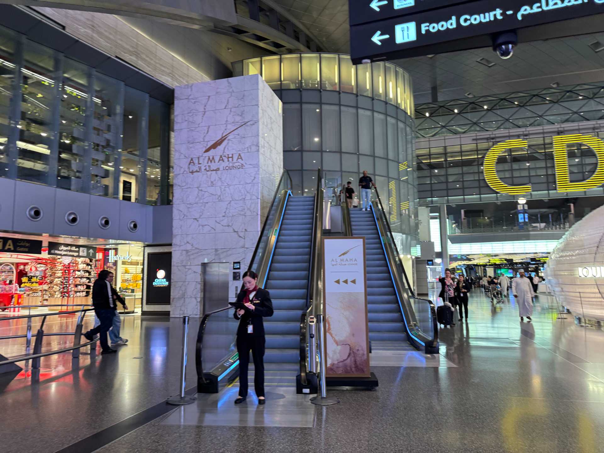 The Al Maha Lounge at Hamad International Airport's main terminal can be easily found by looking for this escalator. The kids were happy with its’ simple food options like pasta and chicken. The Al Maha Lounge serving Gates D and E offered a quieter space with plenty of seating. If you’re traveling with kids and looking for a low-key, family-friendly lounge, Al Maha is a solid option-1