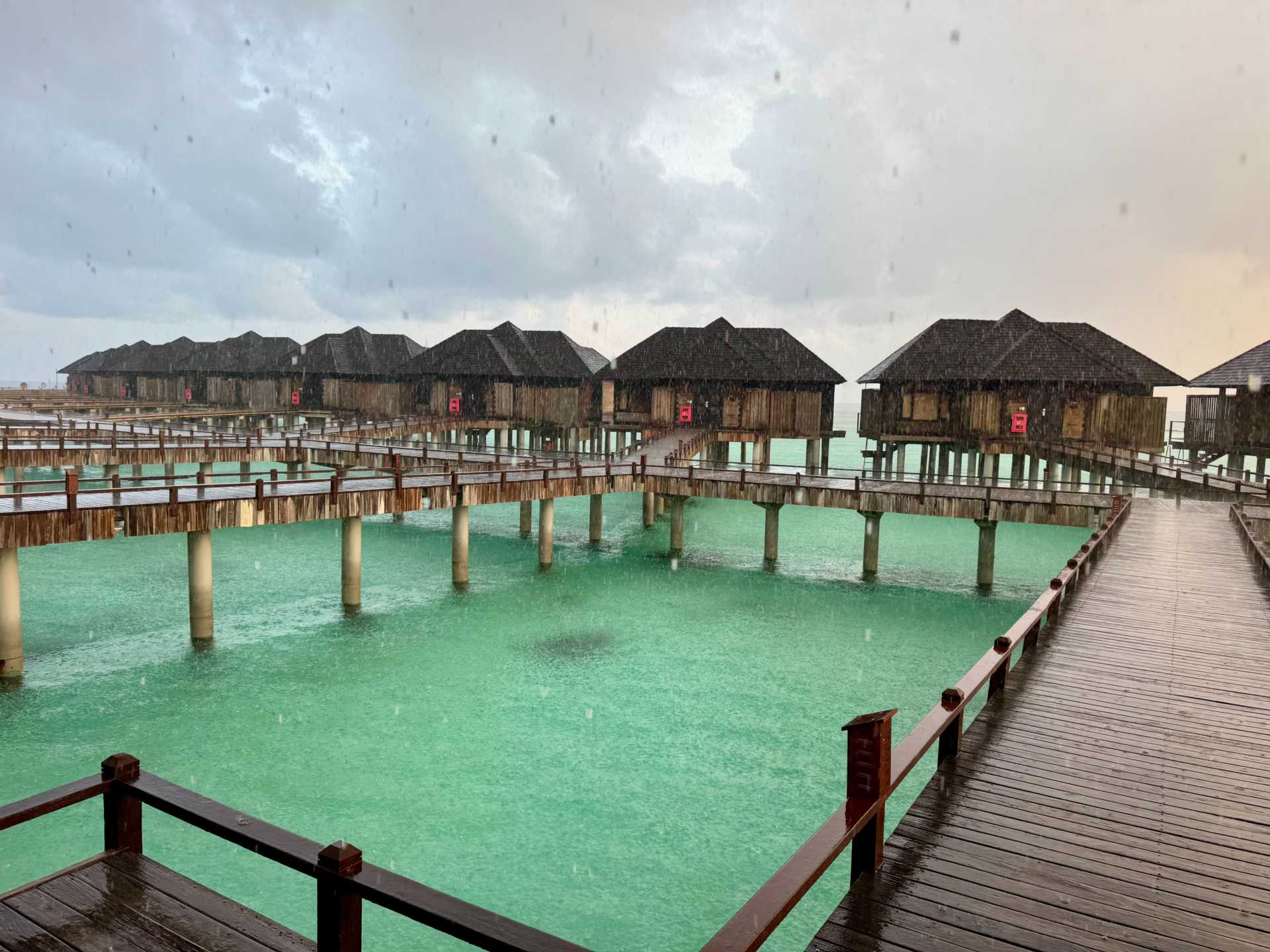 Sun Siyam Iru Sushi Sunset Horizon Overwater Villas in the rain