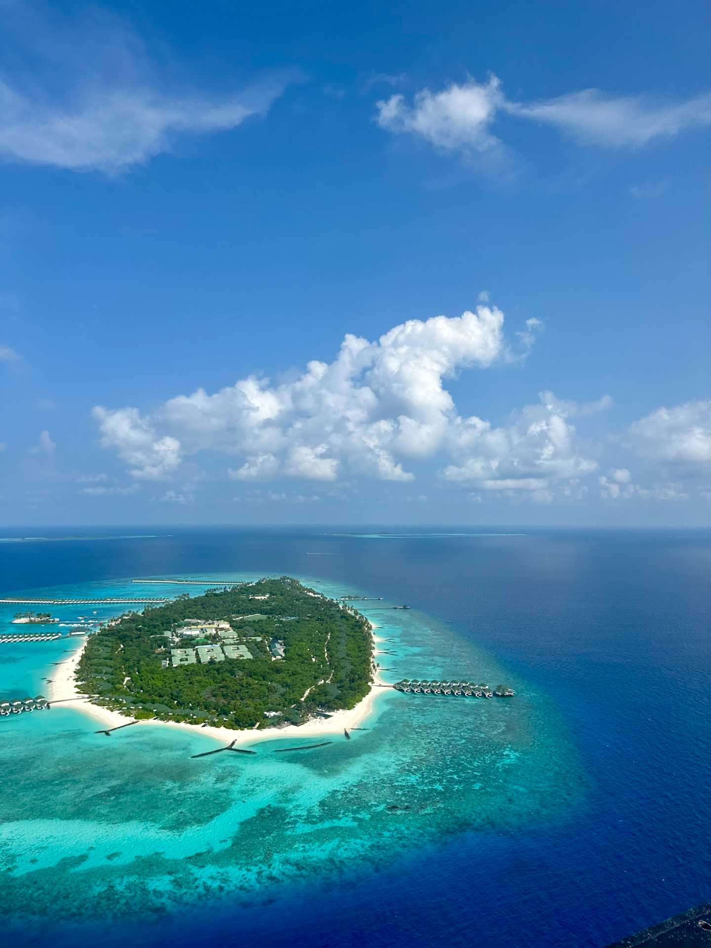 The views from the seaplane were absolutely breathtaking—turquoise at every turn. I managed to snap a few photos in between deep breaths and waves of nausea. Even queasy, it’s hard not to be in awe of the Maldives from above-1