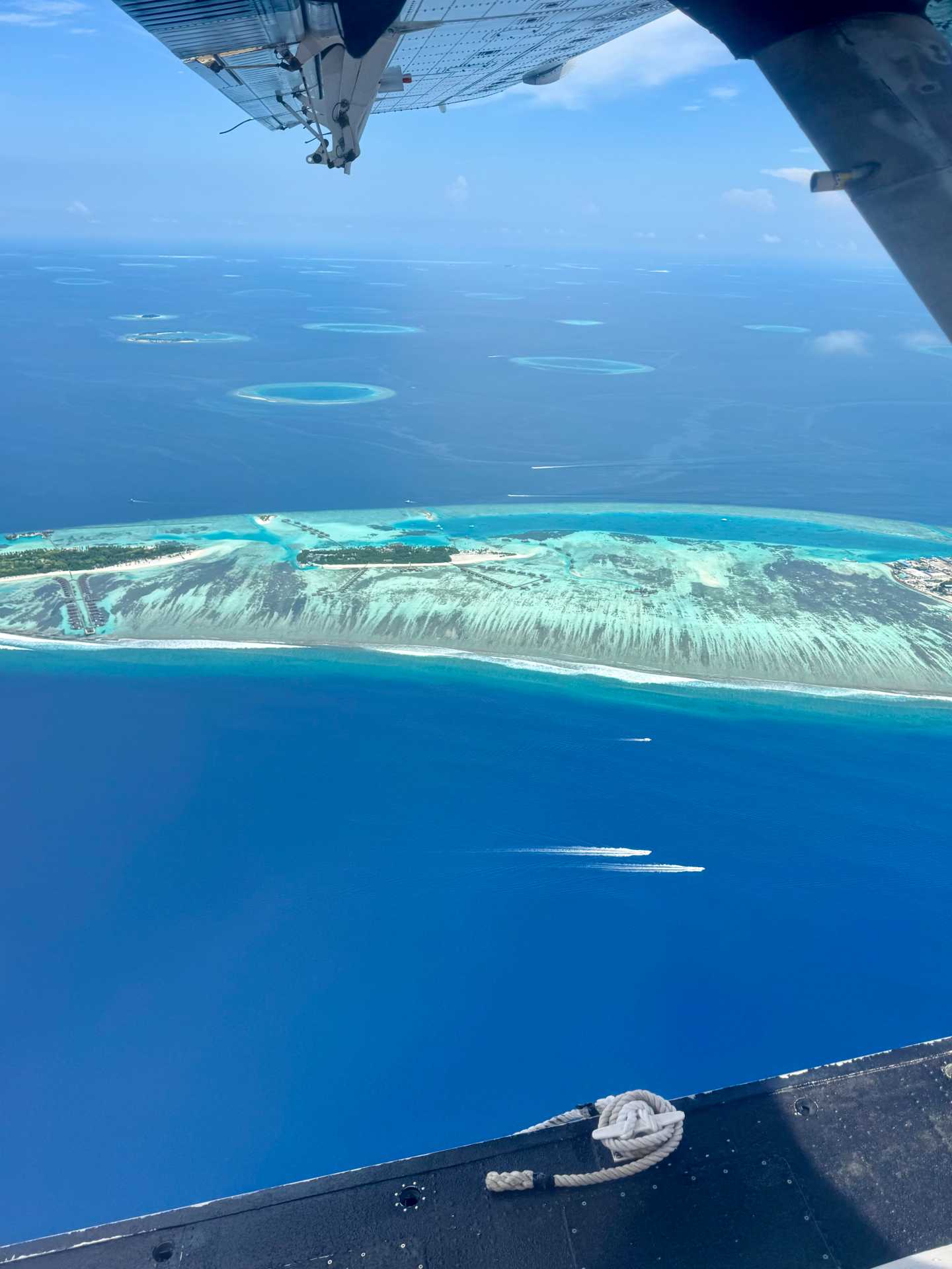 The views from the seaplane were absolutely breathtaking—turquoise at every turn. I managed to snap a few photos in between deep breaths and waves of nausea. Even queasy, it’s hard not to be in awe of the Maldives from above-2