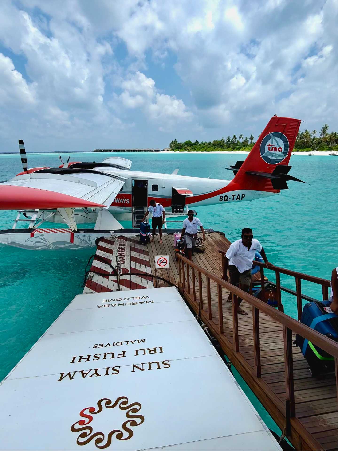 The views from the seaplane were absolutely breathtaking—turquoise at every turn. I managed to snap a few photos in between deep breaths and waves of nausea. Even queasy, it’s hard not to be in awe of the Maldives from above-3